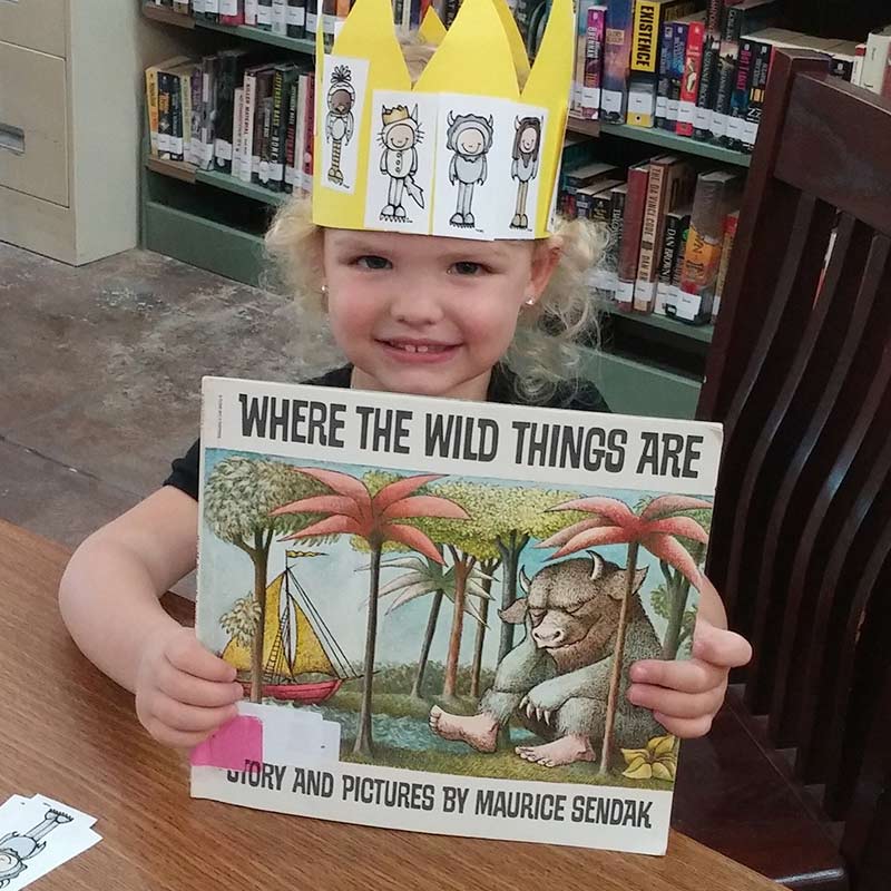 young reader holding book